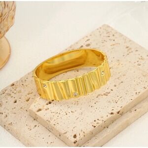 Gold Tone Textured Cuff BraceleGold Tone Textured Cuff Bracelet with Rhinestones